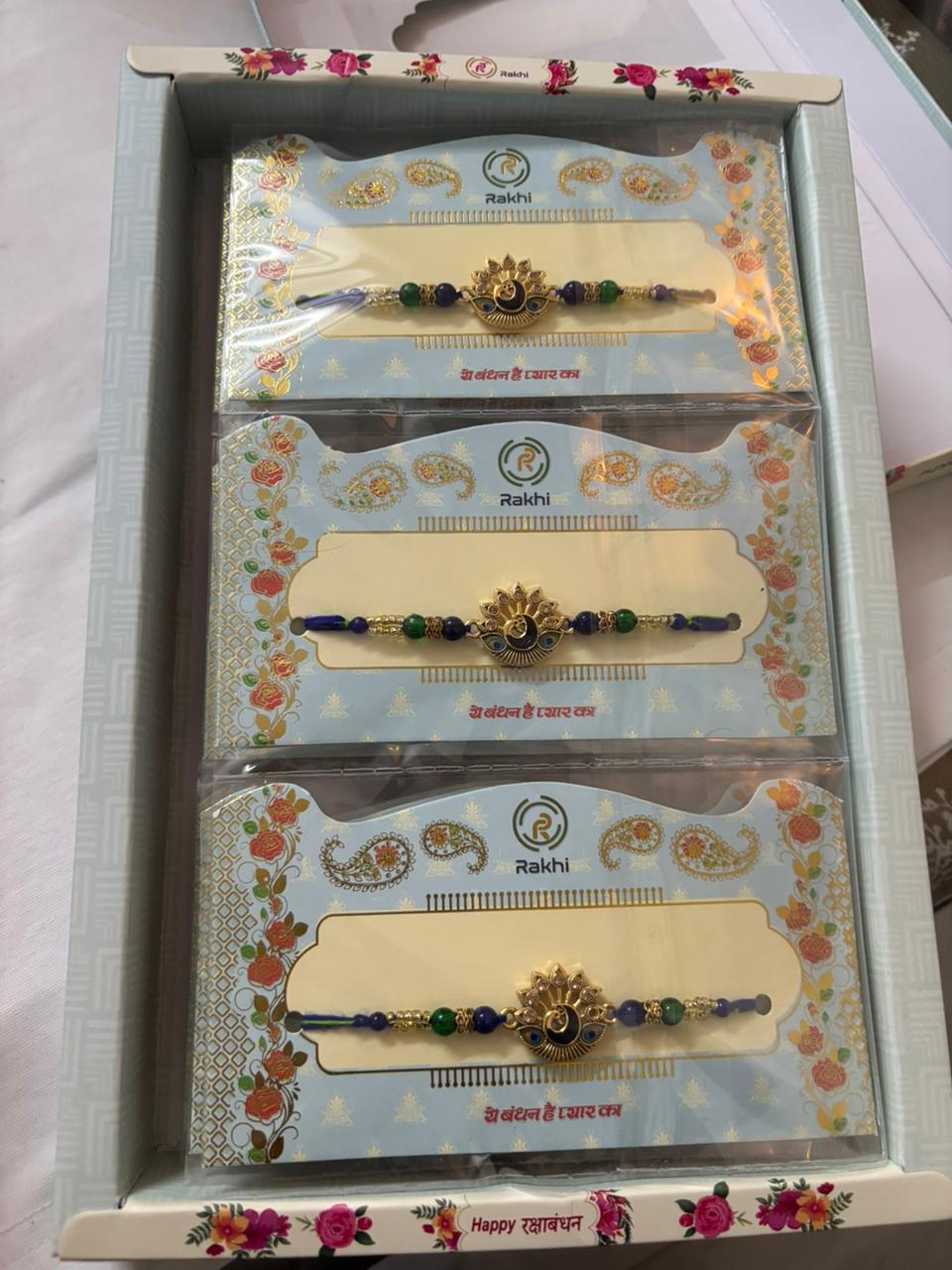 Golden-Black Rakhi Set BUTTON CRYP – with Free Roli Chawal, Chocolate and Greeting Card