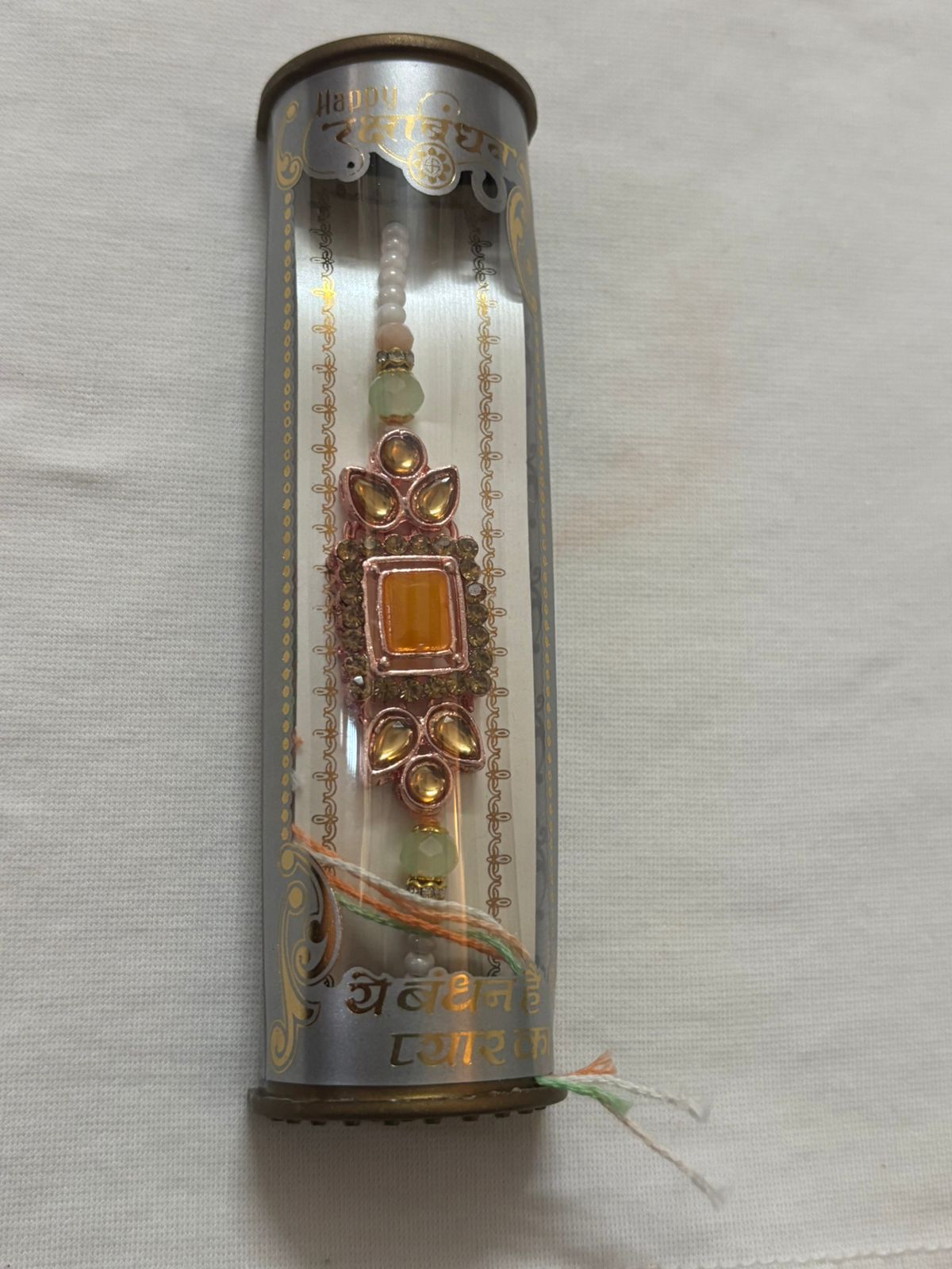 BUTTON CRYP Golden Rakhi – Single Rakhi with Roli Chawal, Greeting Card and Chocolate