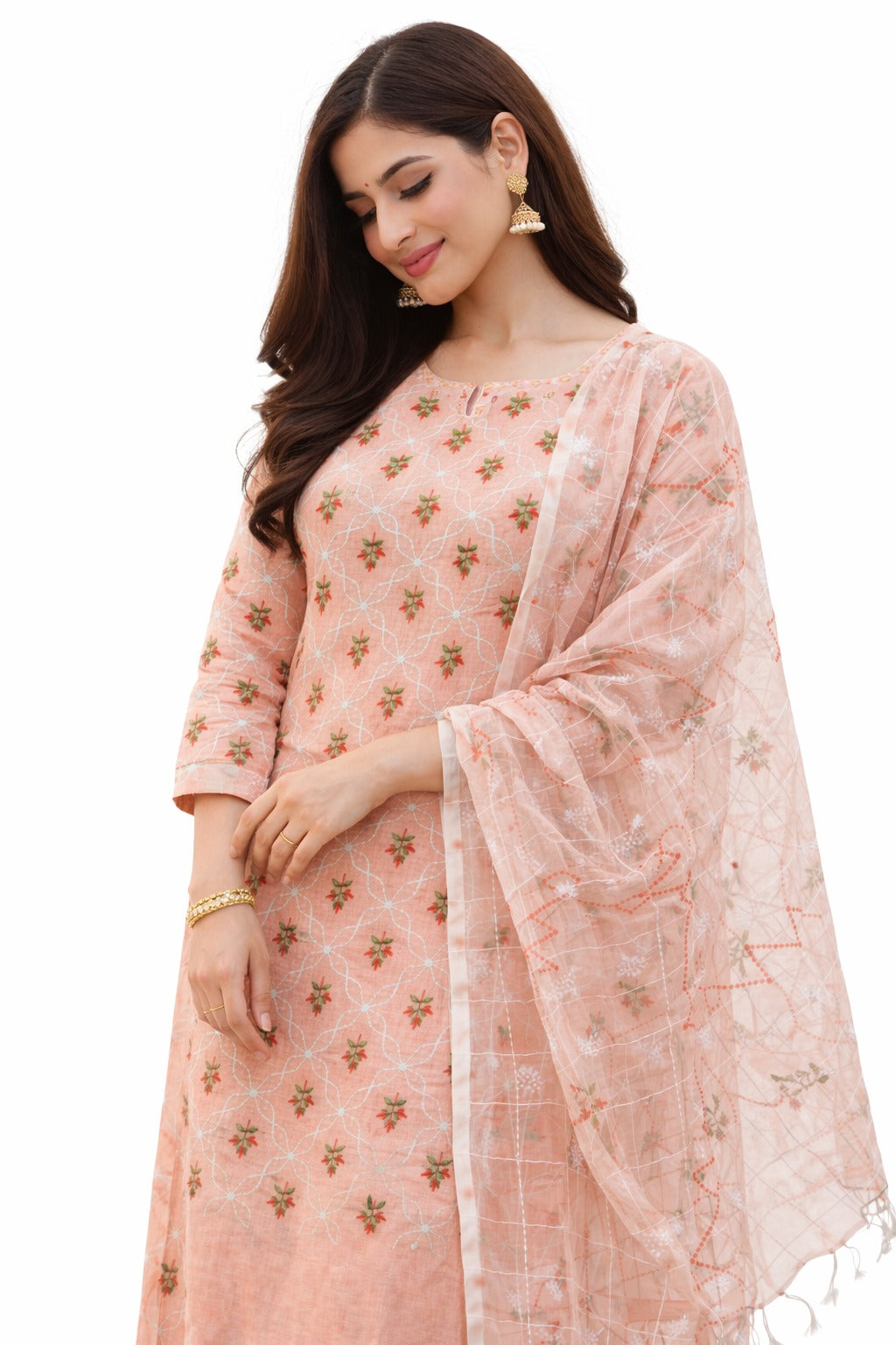 woman wearing peach colored embroidery with floral work on it